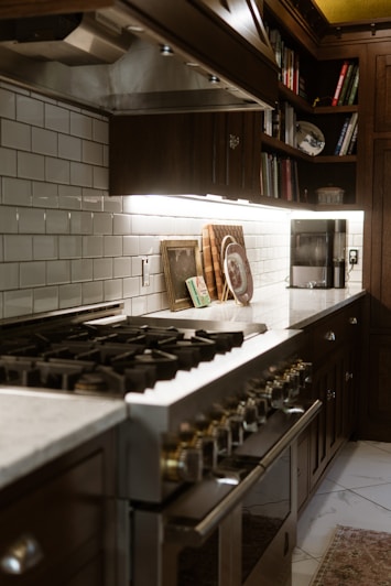 A kitchen with a stove, oven and cabinets