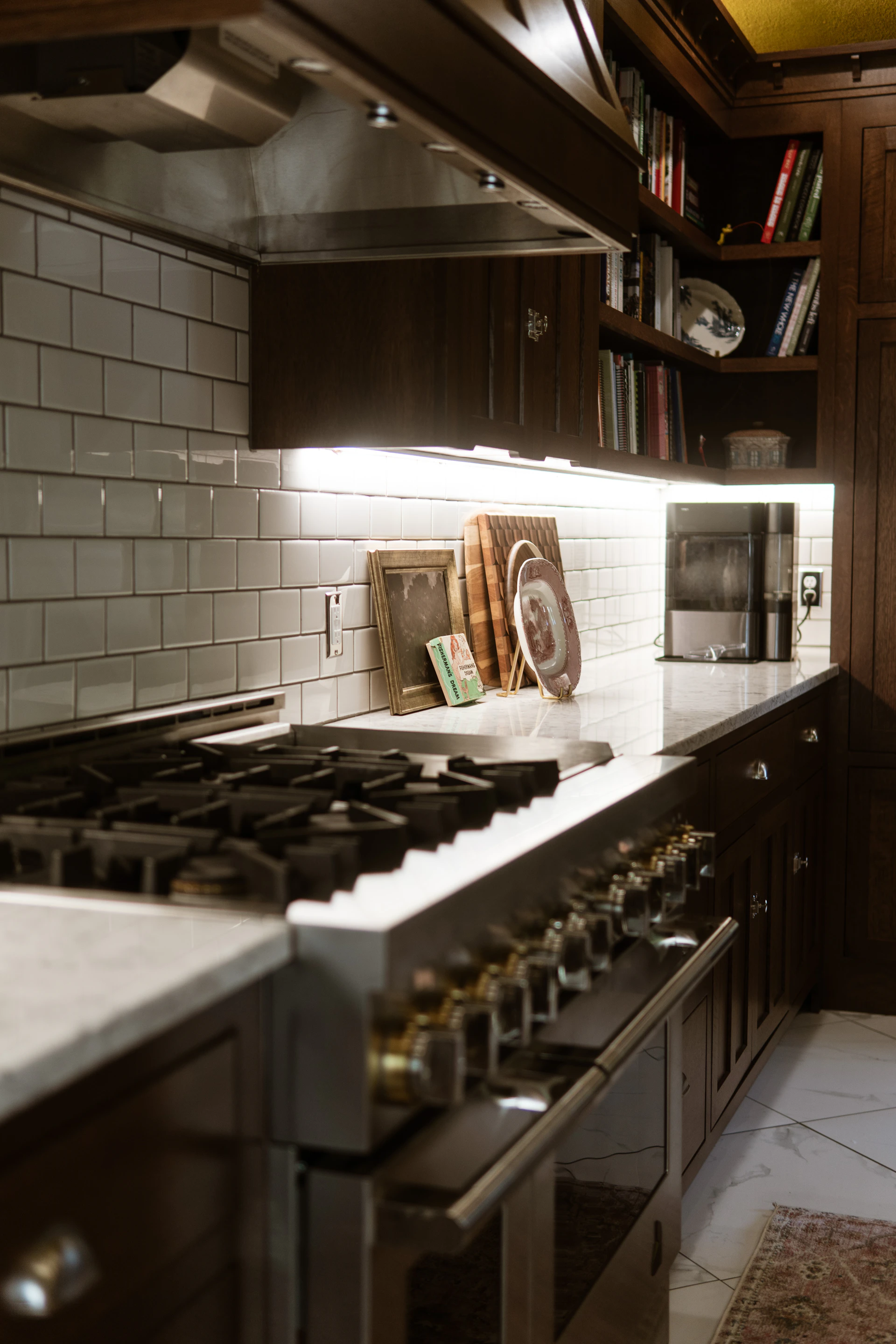 A kitchen with a stove, oven and cabinets