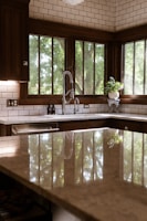 A large kitchen with a center island in the middle of it