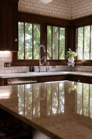 A large kitchen with a center island in the middle of it