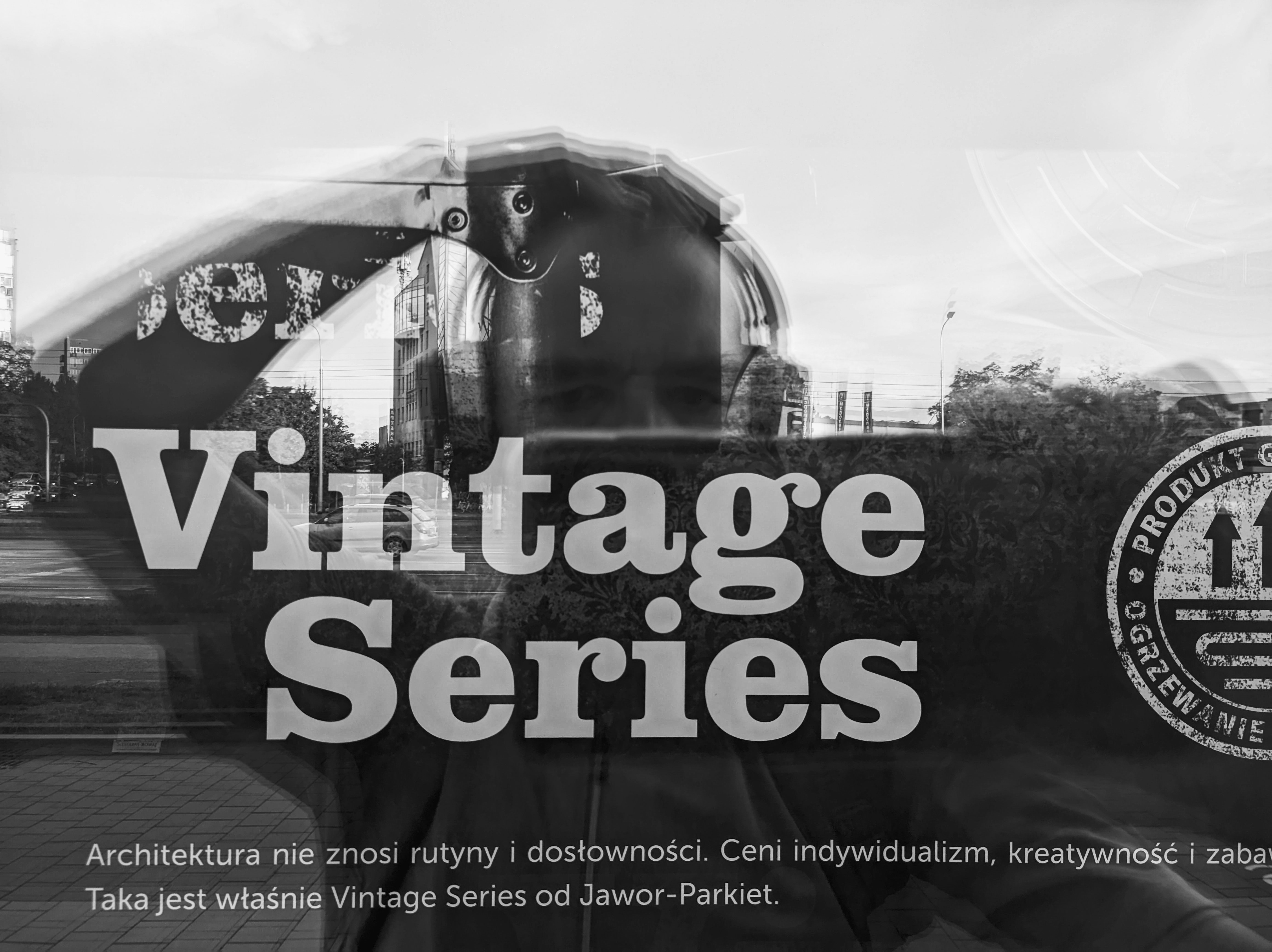 A black and white photo of a man standing in front of a train