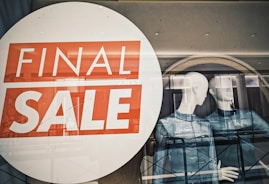A window with a sale sign in it