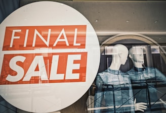 A window with a sale sign in it