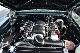 The engine compartment of a car with the hood open