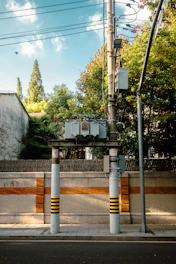 A couple of poles that are next to a street