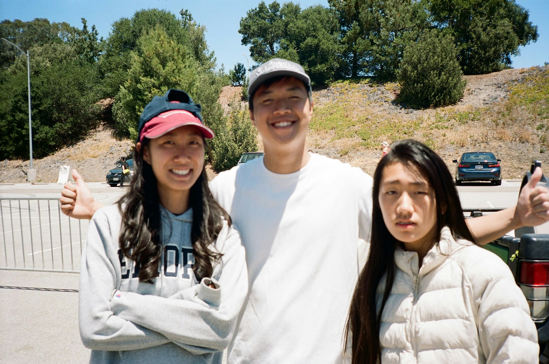 A man and two women standing next to each other