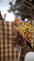 A woman with a colorful head scarf on her head