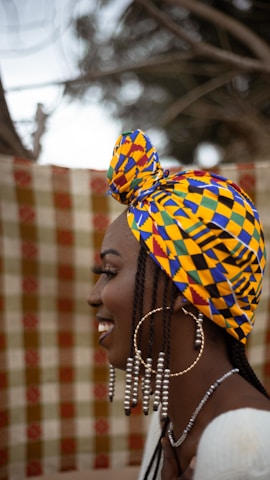 A woman with a colorful head scarf on her head