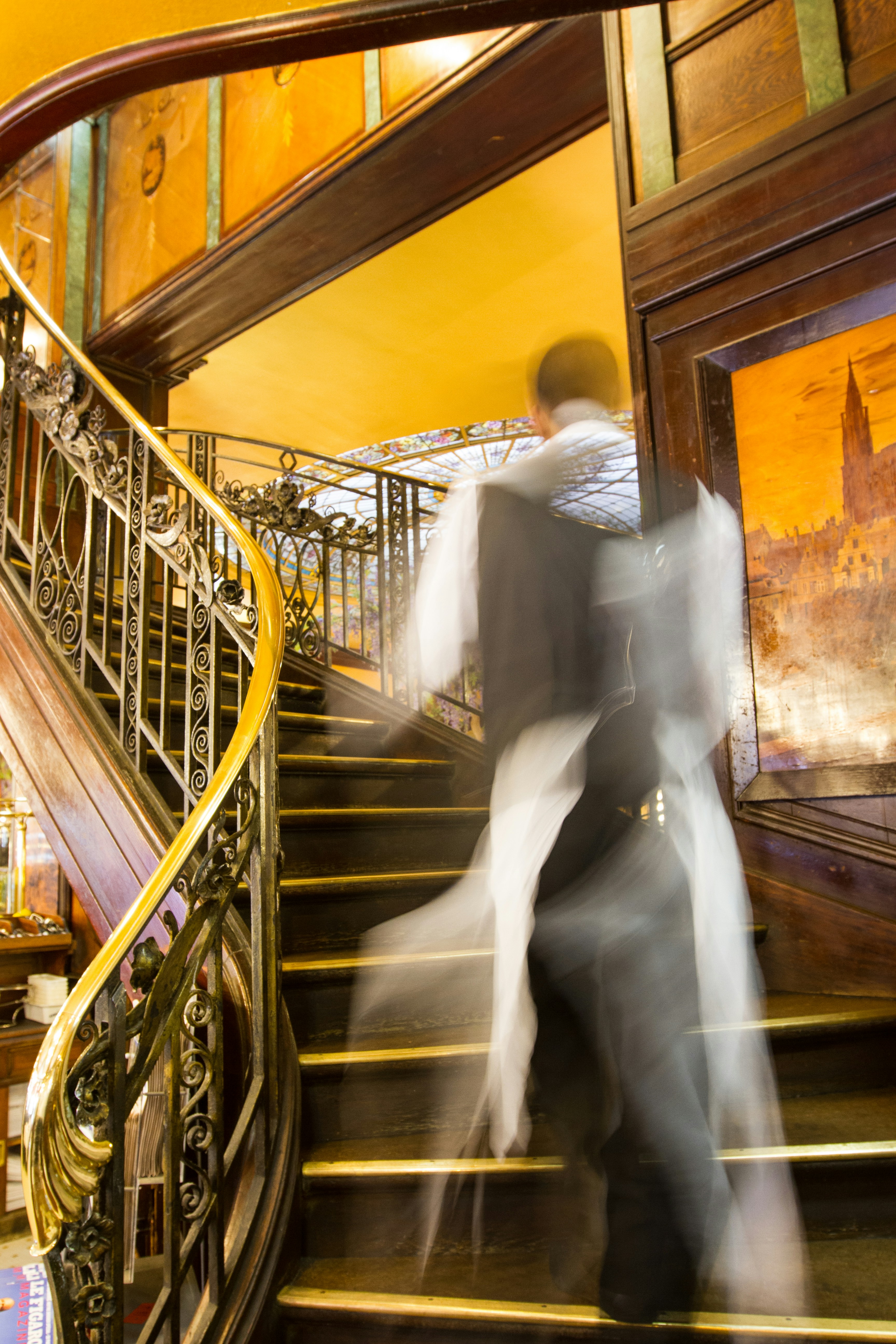 A couple of people that are walking down some stairs