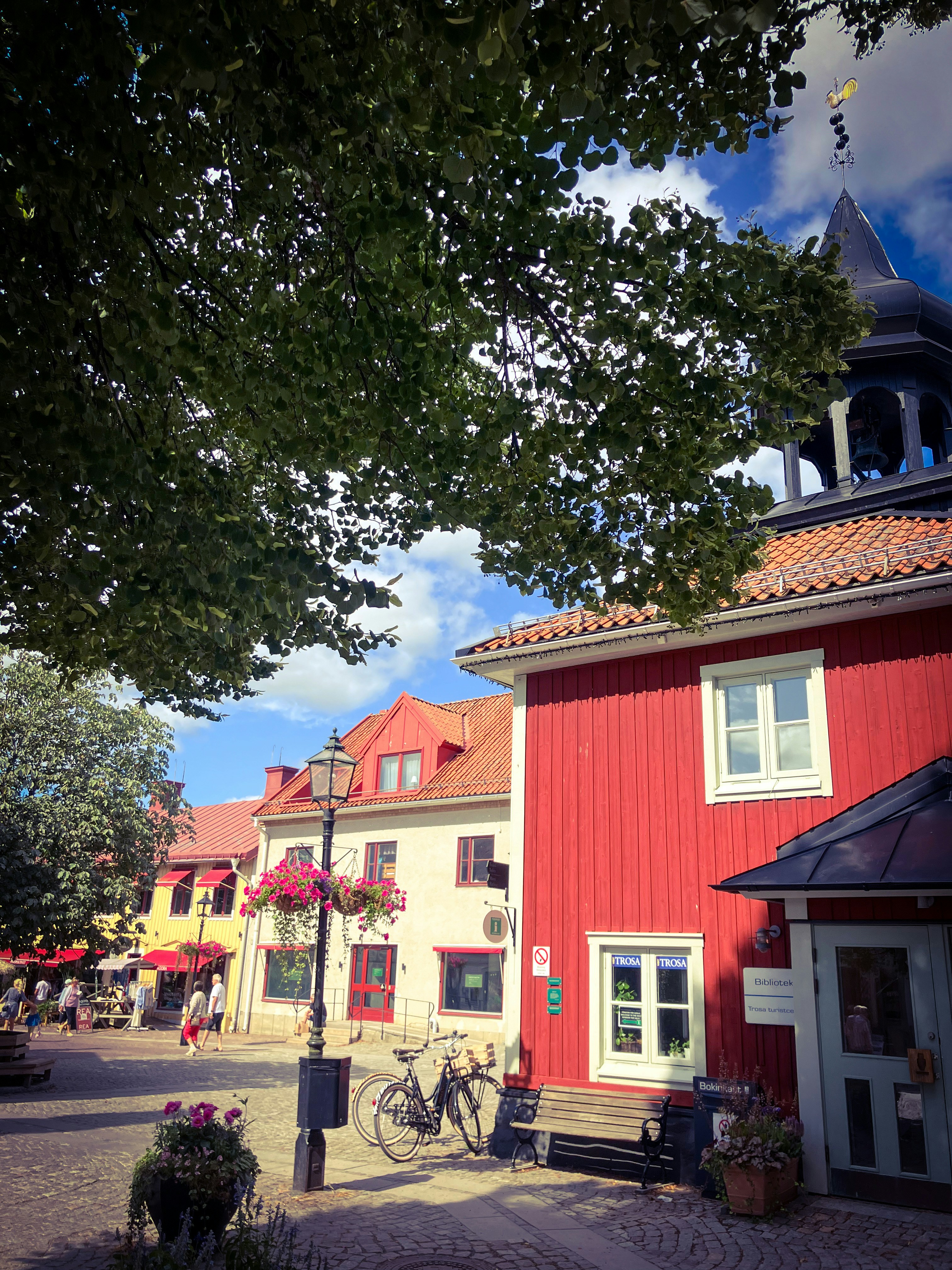 A red building with a clock tower on top of it
