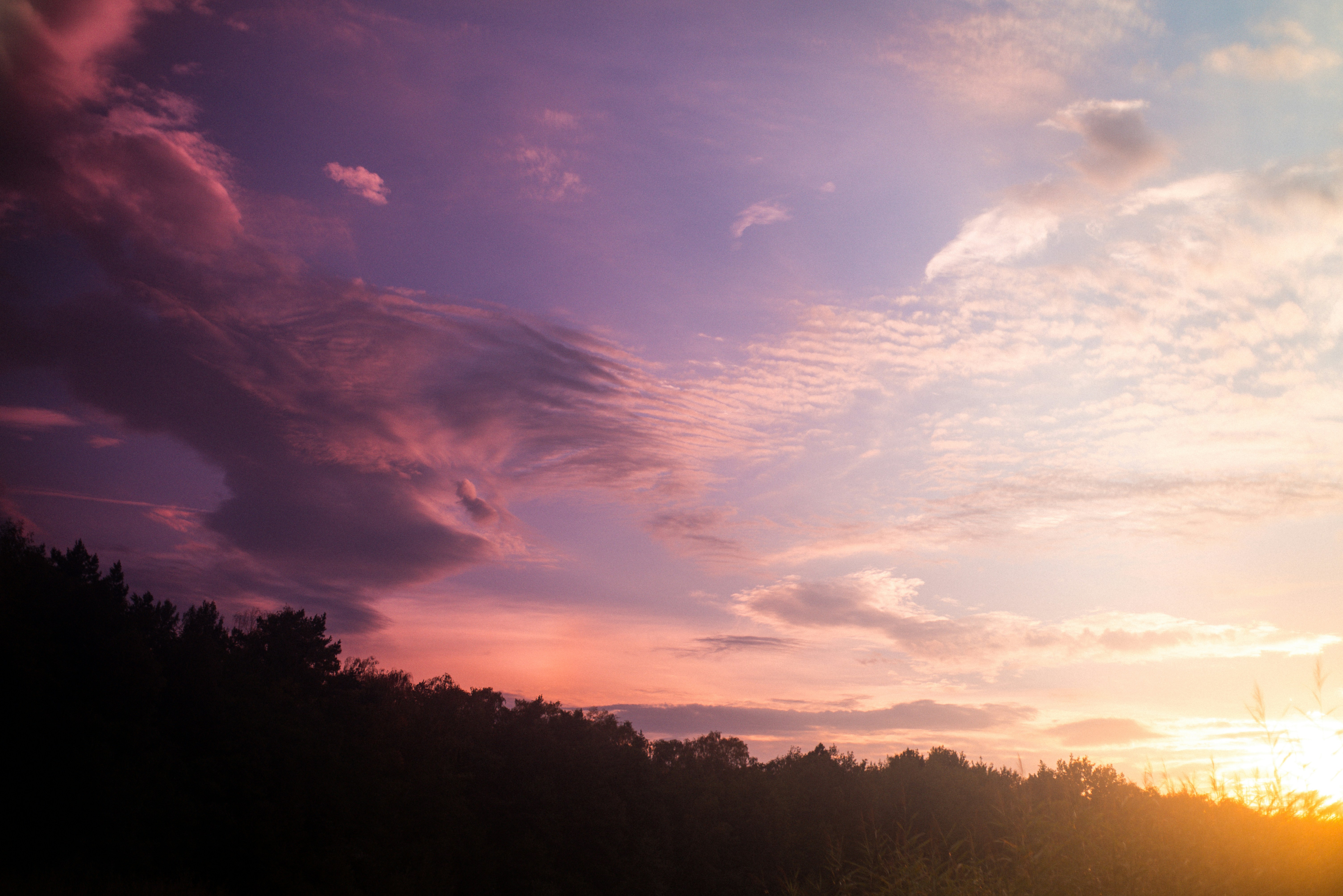 The sun is setting over a body of water