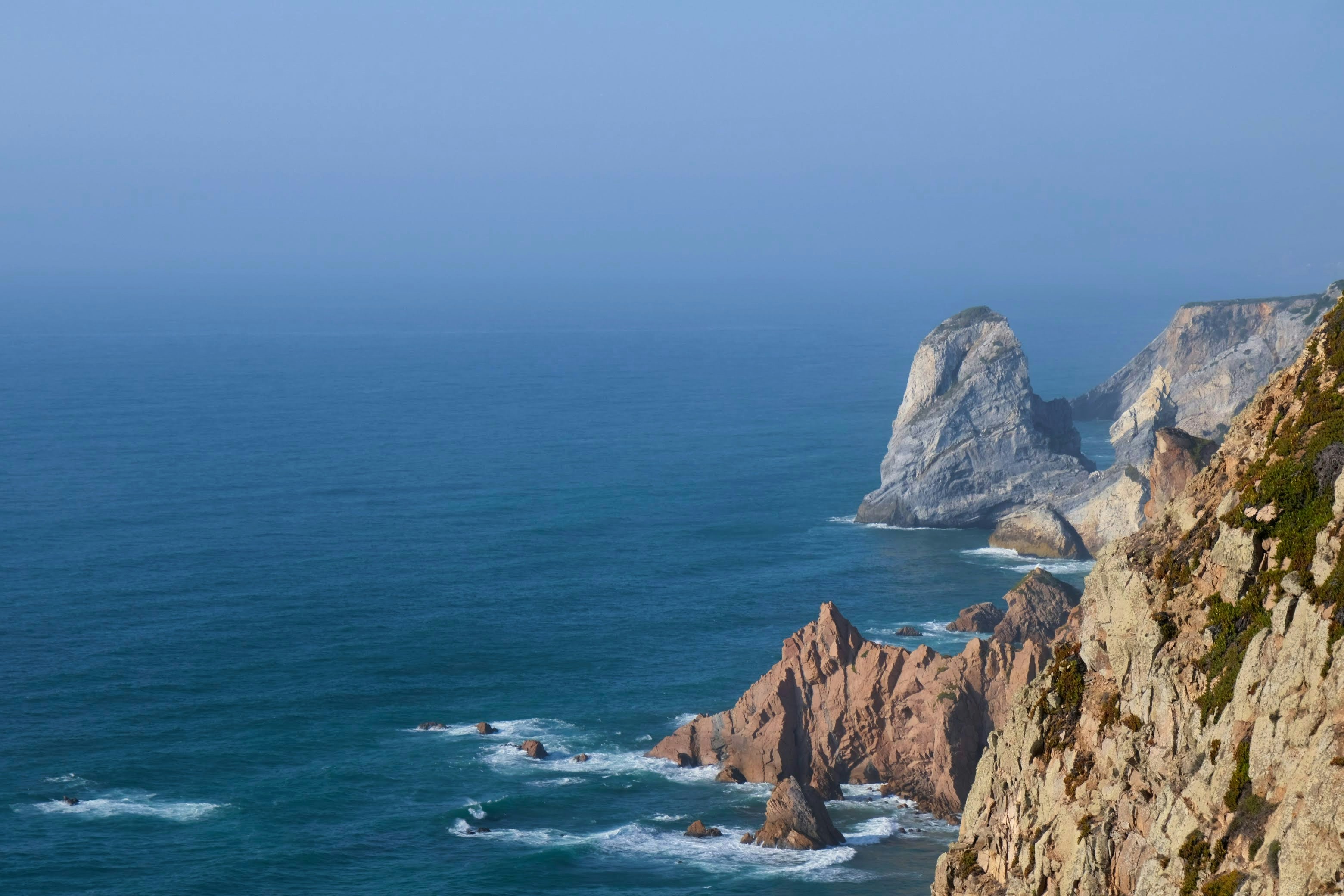 A view of the ocean from the top of a mountain