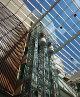 A tall glass building with a skylight above it