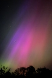 The aurora bore is visible in the night sky