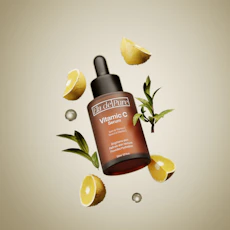 A bottle of vitamin c on top of lemon slices