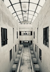 A long narrow hallway with a skylight above it