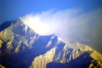 A view of a snow covered mountain from an airplane