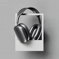 A pair of headphones hanging from a wall