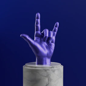 A purple hand sticking out of a marble container