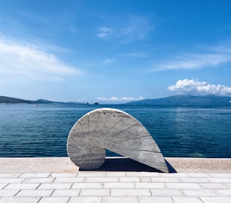 A large object sitting on top of a brick walkway
