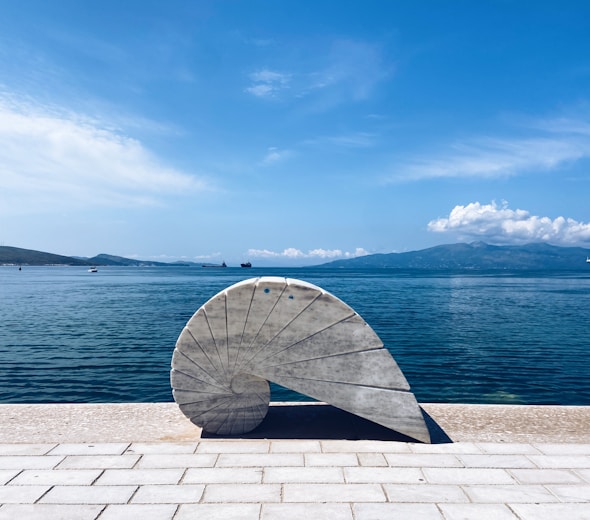 A large object sitting on top of a brick walkway