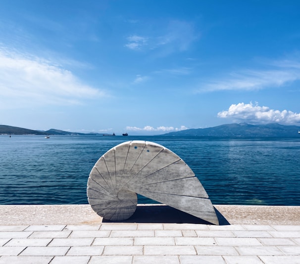 A large object sitting on top of a brick walkway
