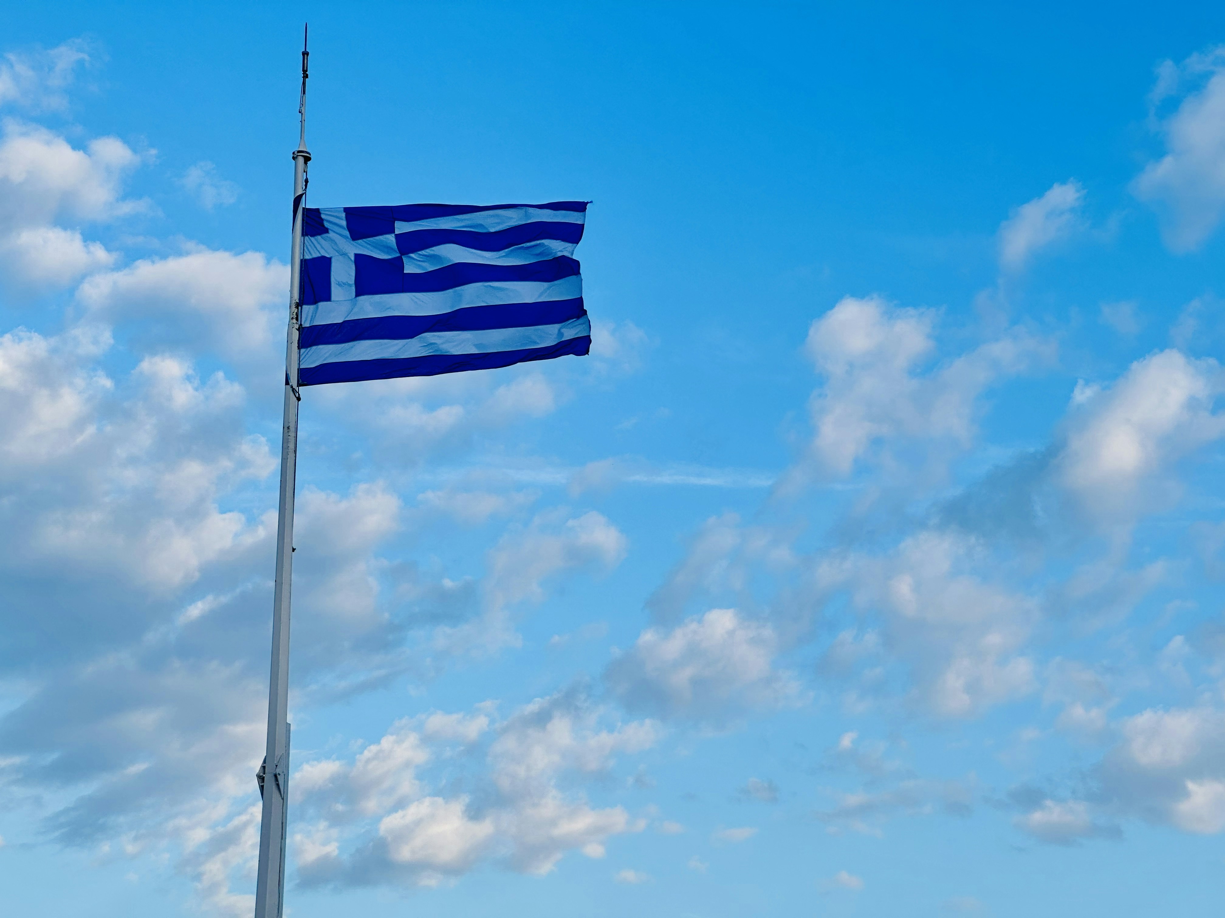 A flag is flying high in the sky