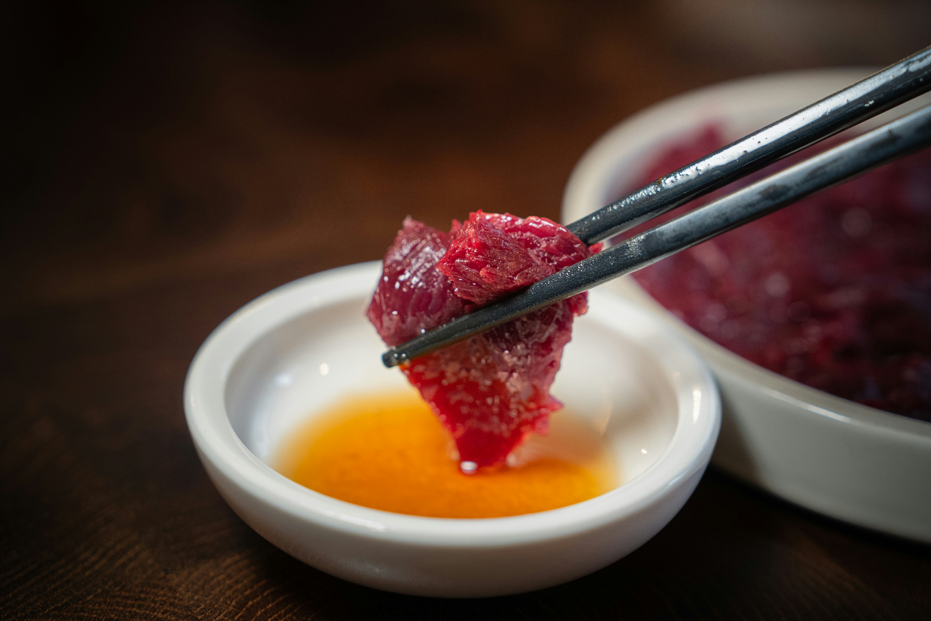 A bowl of food with chopsticks sticking out of it