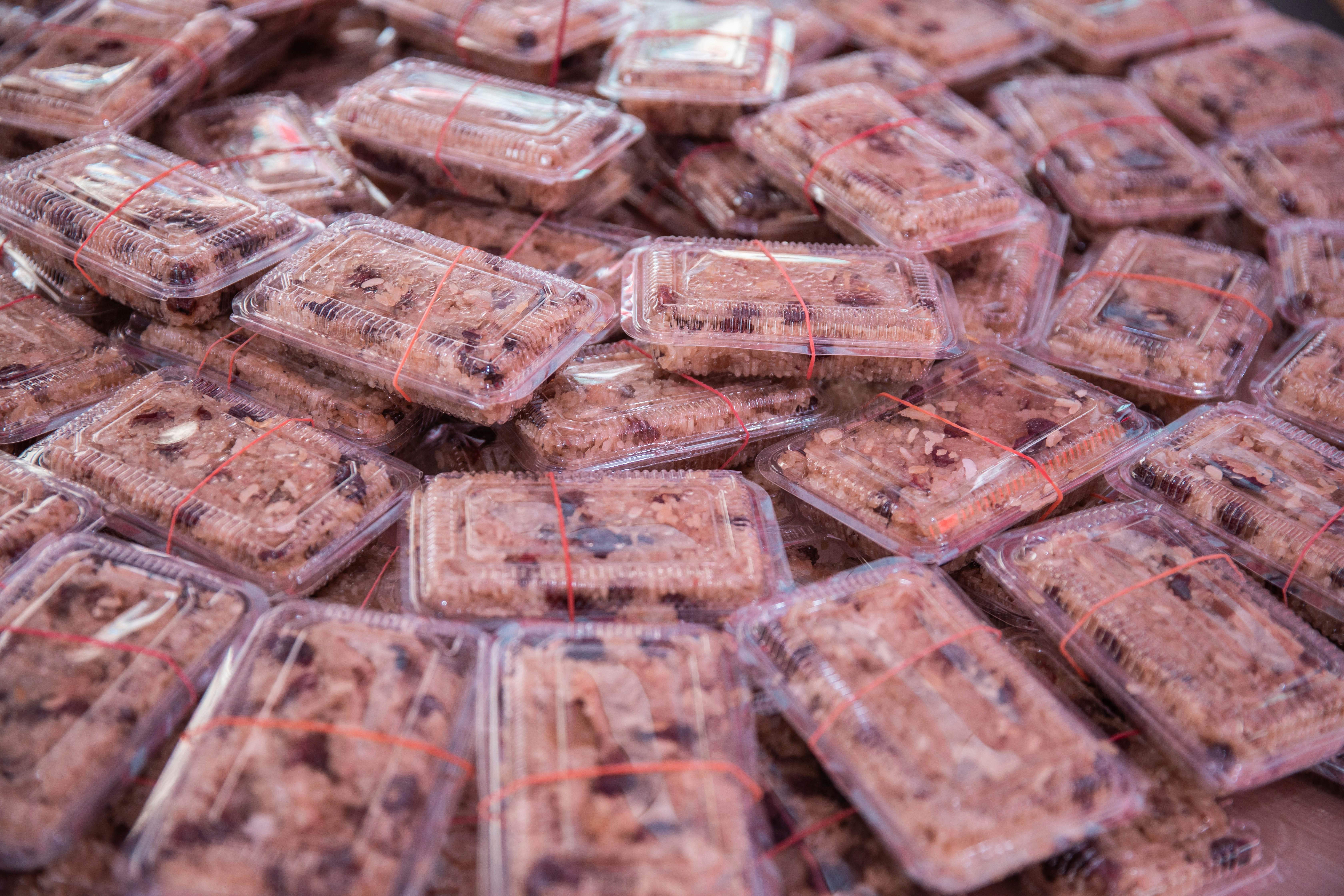 A large amount of chocolates are in plastic bags