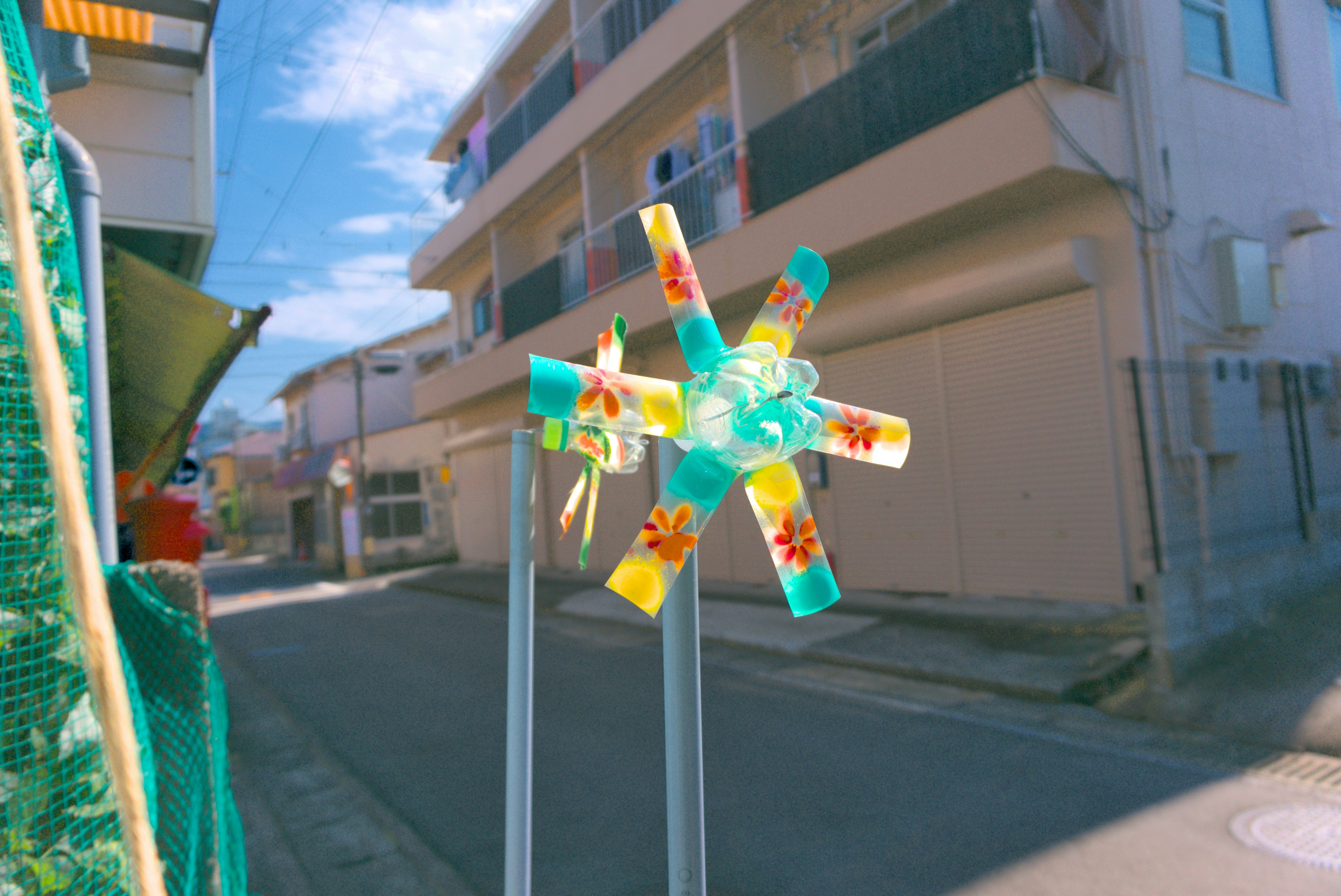 A street view of a building and a colorful pinwheel photo – Free Flower ...