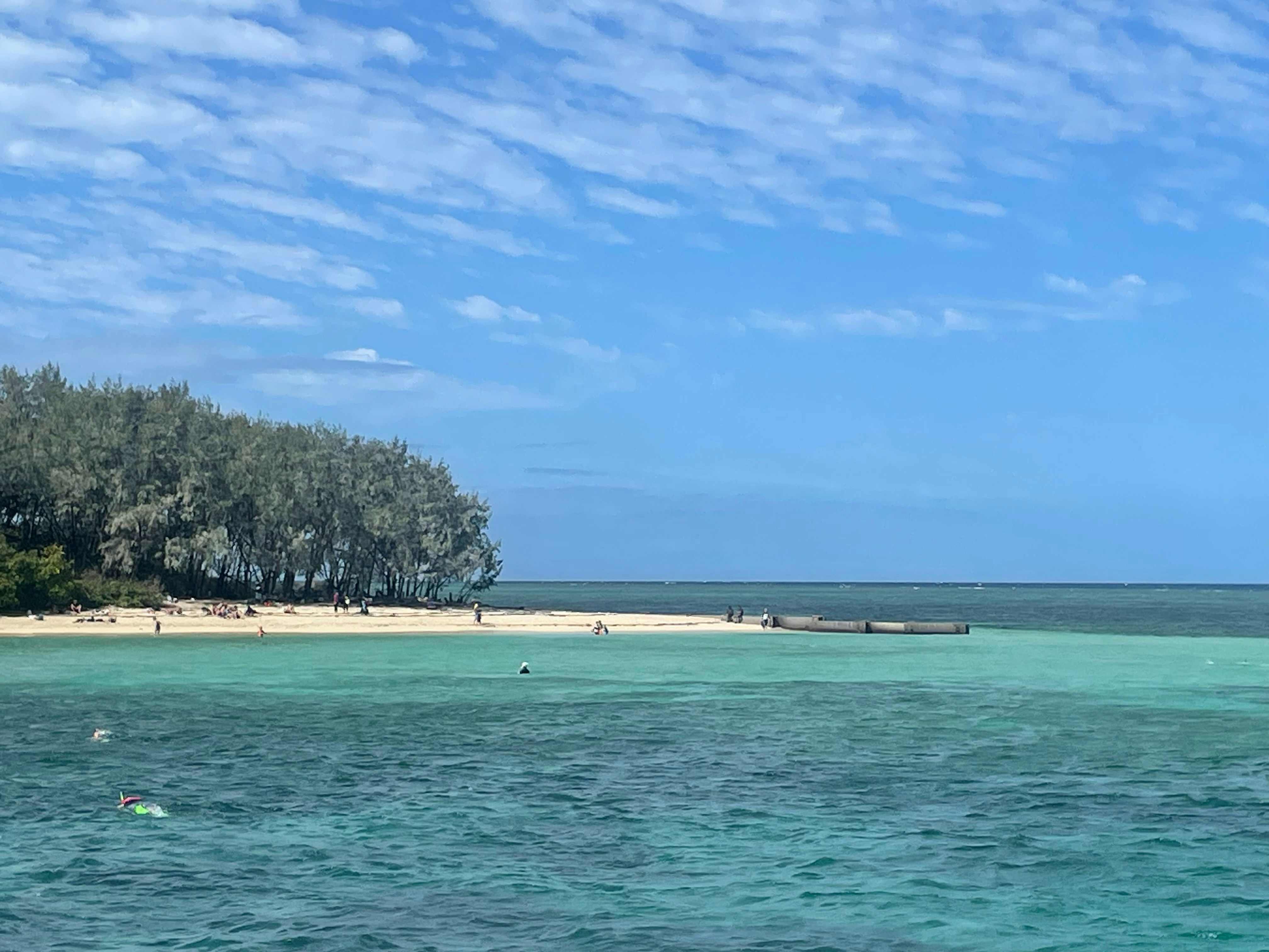 A boat floating on top of a body of water