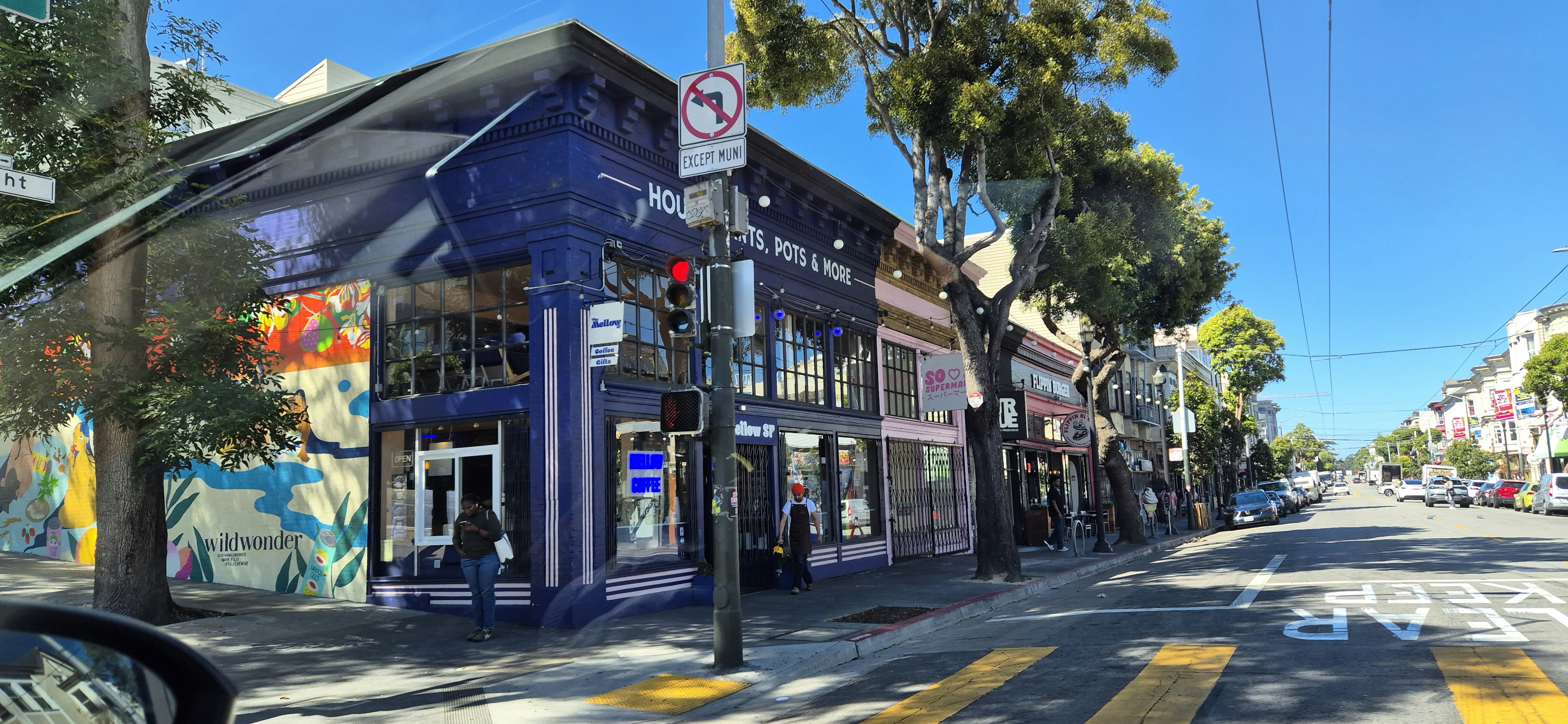 A street view of a building with a lot of graffiti on it