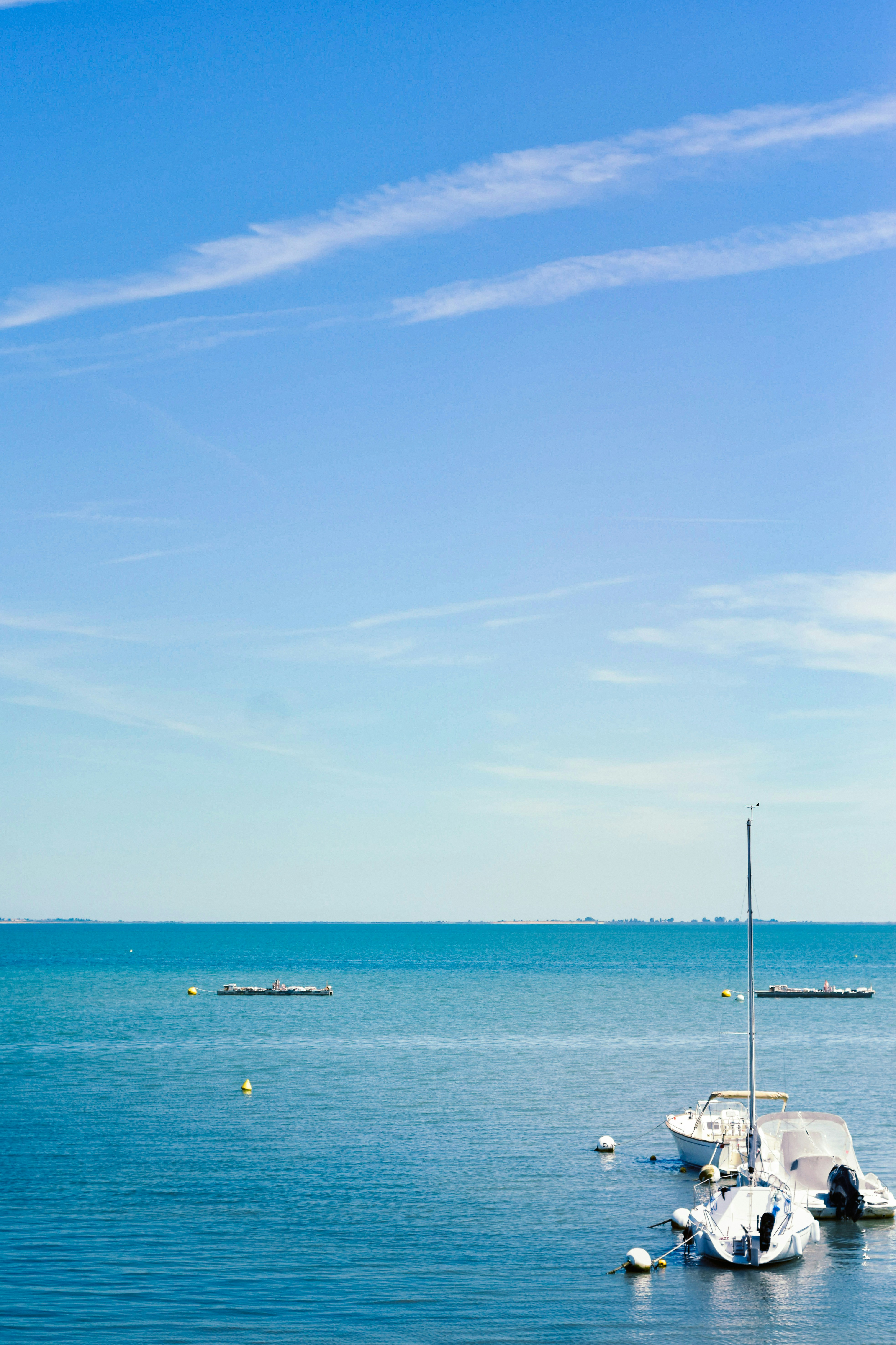 A body of water with boats floating on top of it