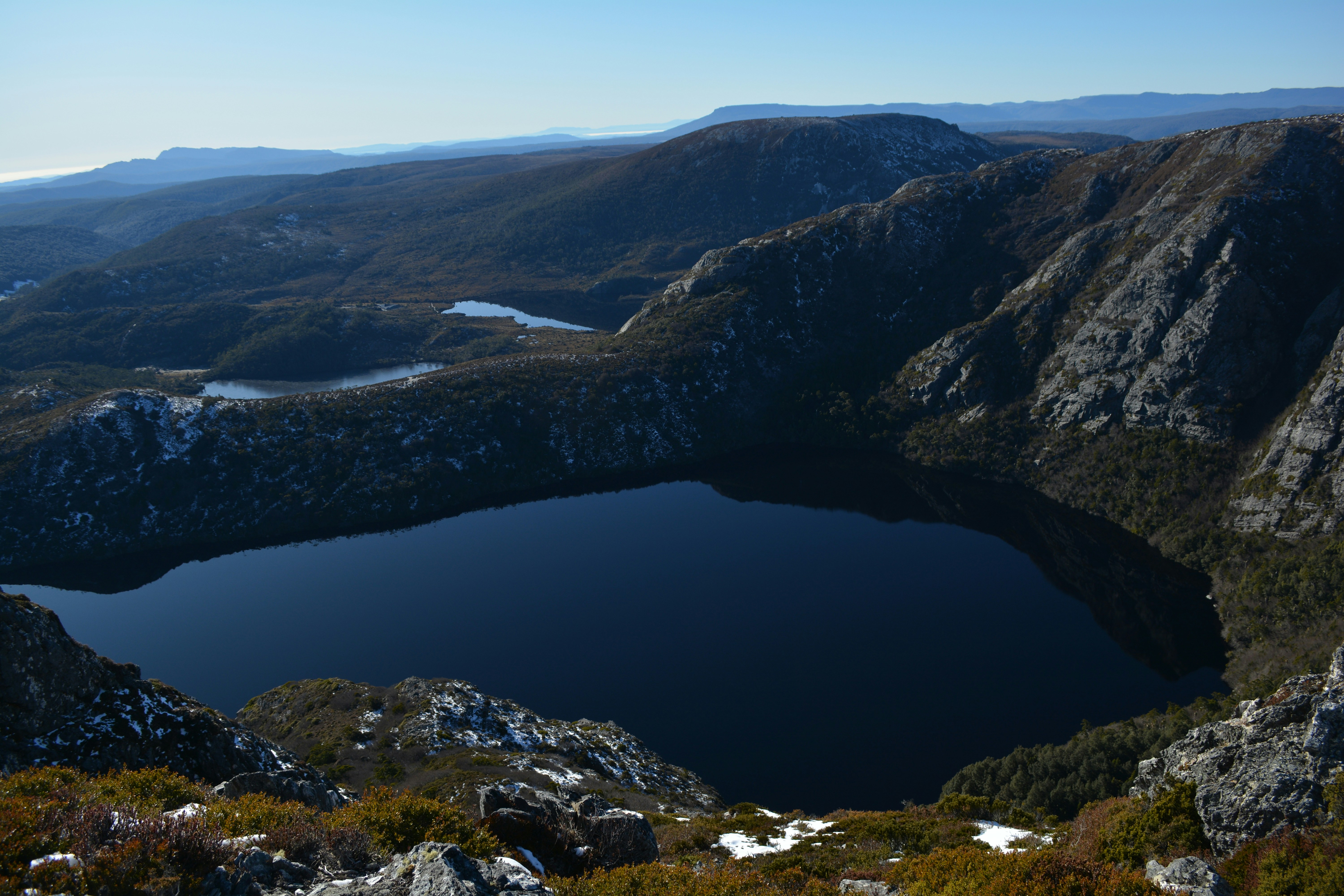 A view of a lake surrounded by mountains