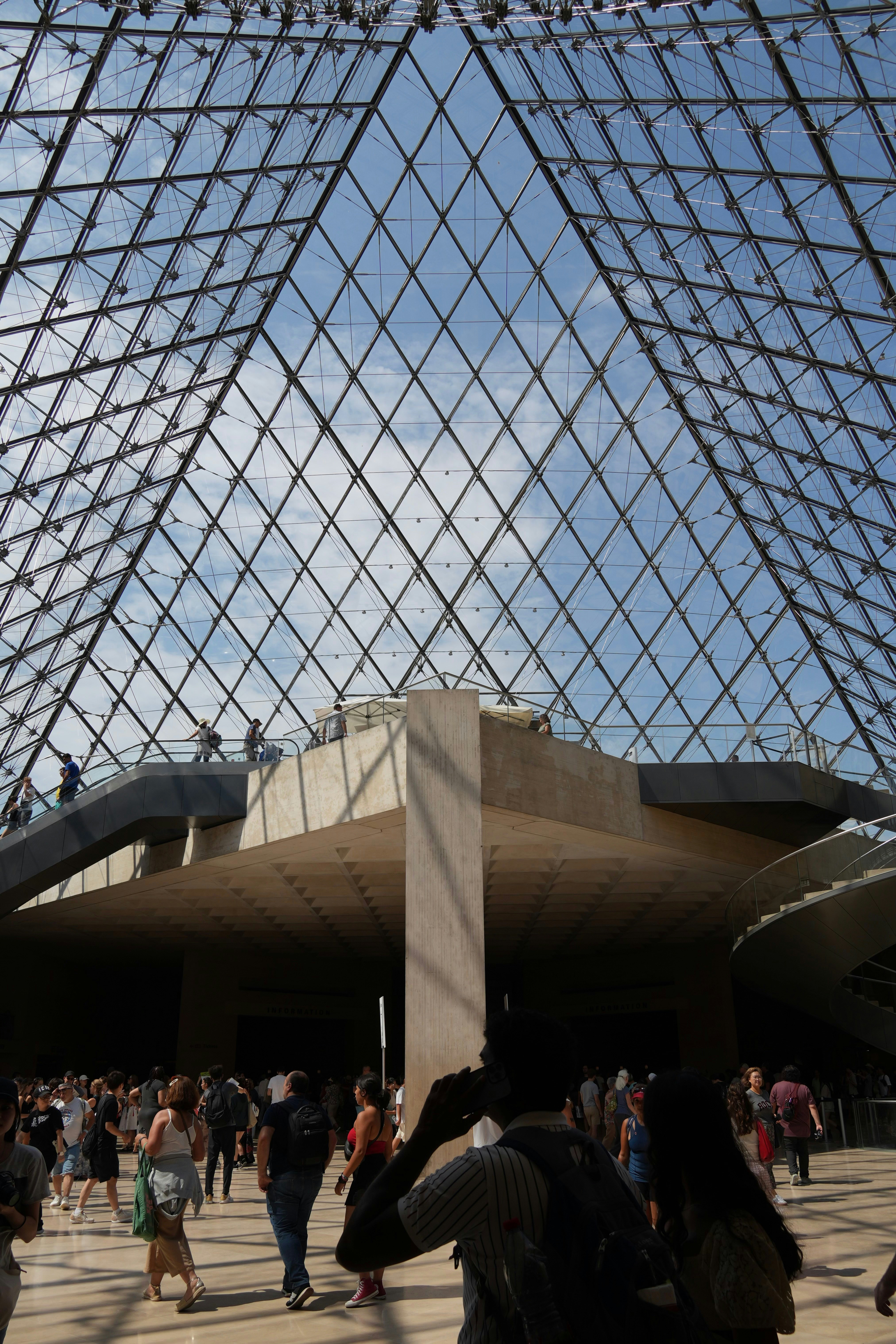 A group of people that are standing in front of a building