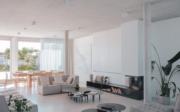 A living room filled with furniture and a fire place