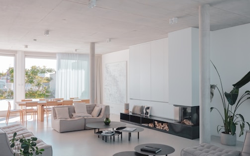 A living room filled with furniture and a fire place