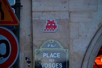 A close up of a street sign near a building
