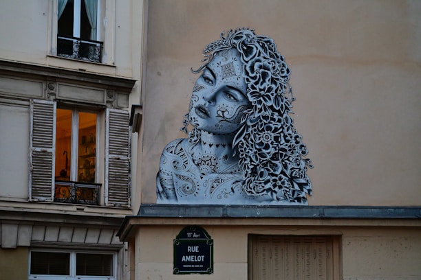 A painting of a woman on the side of a building