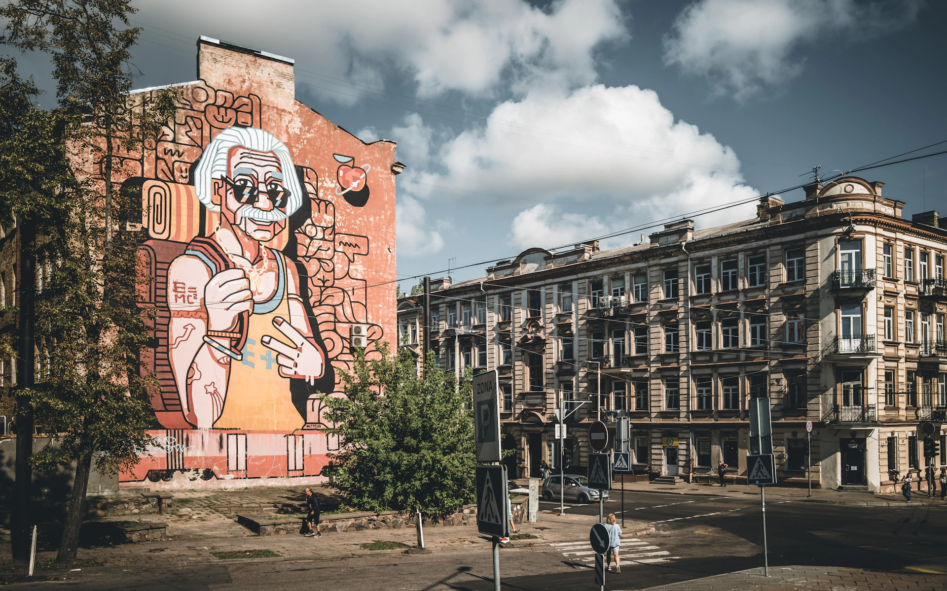 A large building with a mural on the side of it