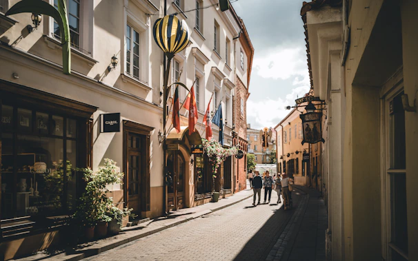 A city street with people walking down it