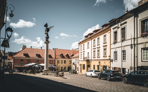A city street with cars parked on the side of it