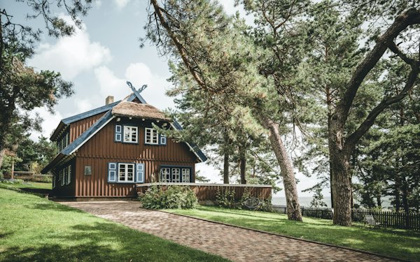 A house in the middle of a grassy area — Curonian Spit, Lithuania