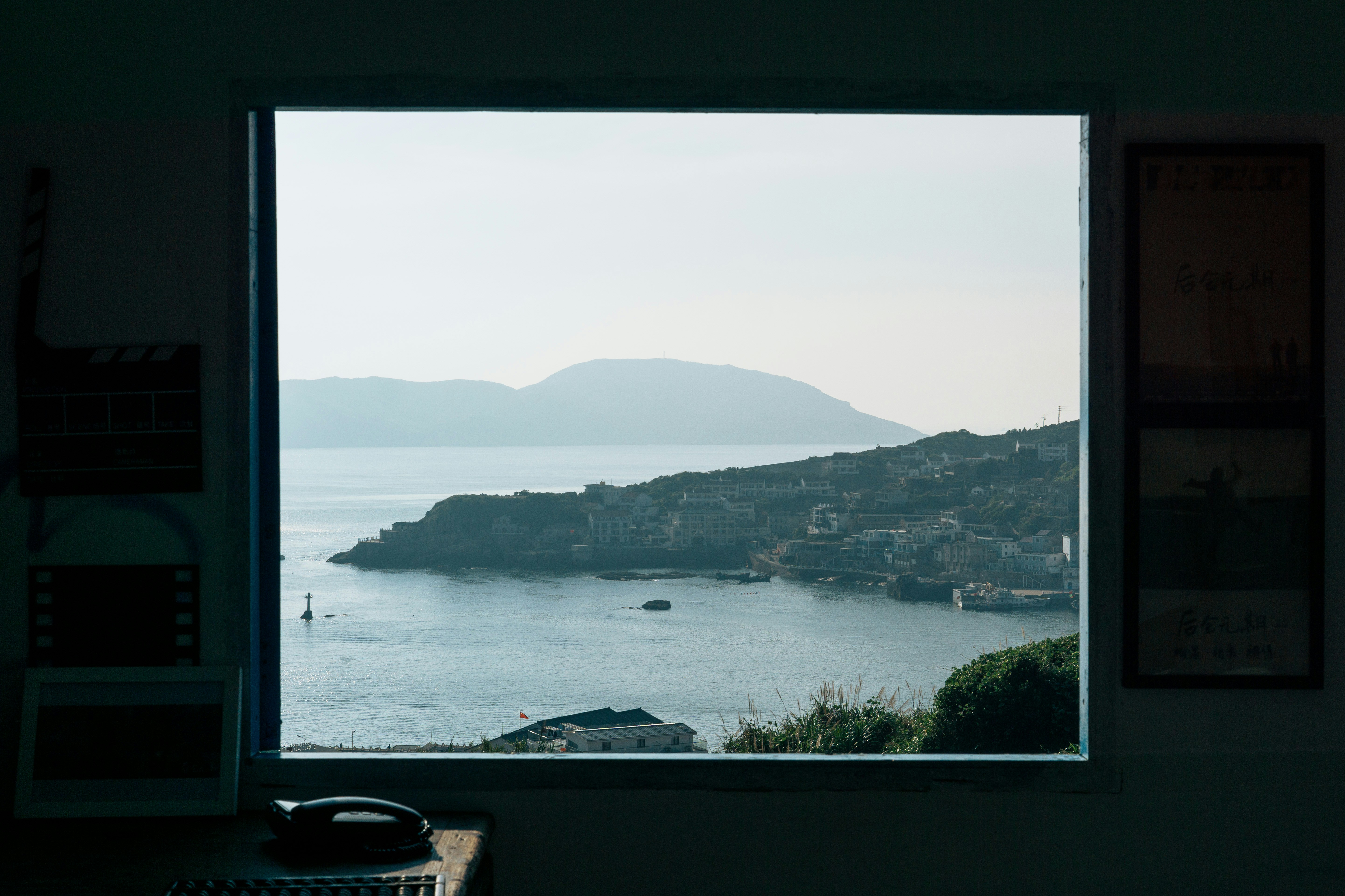 A window with a view of a body of water
