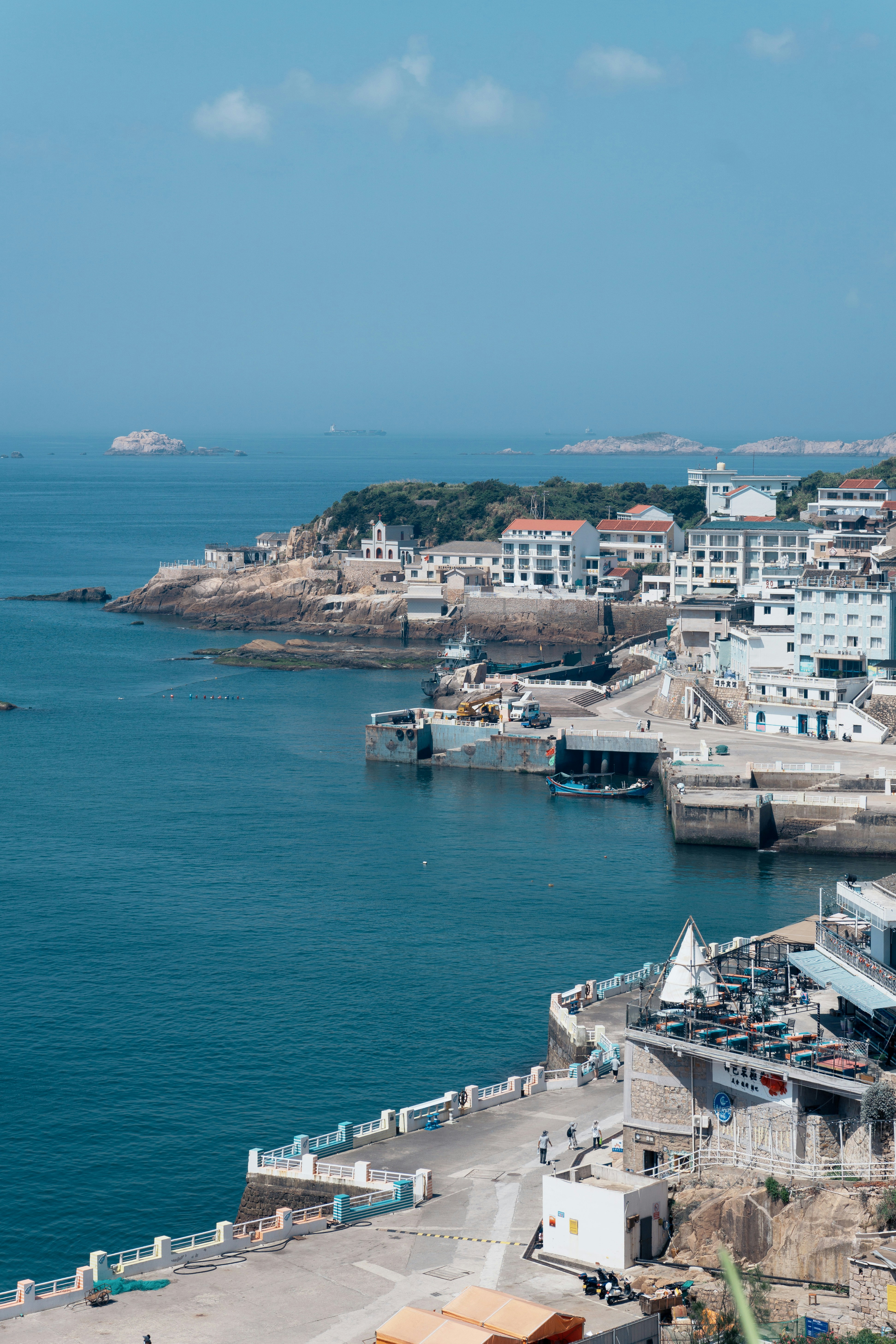 A view of a body of water with a city in the background