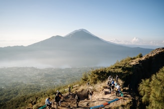 A group of people hiking up a mountain