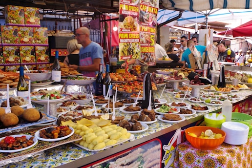 A food stand with many plates of food on it