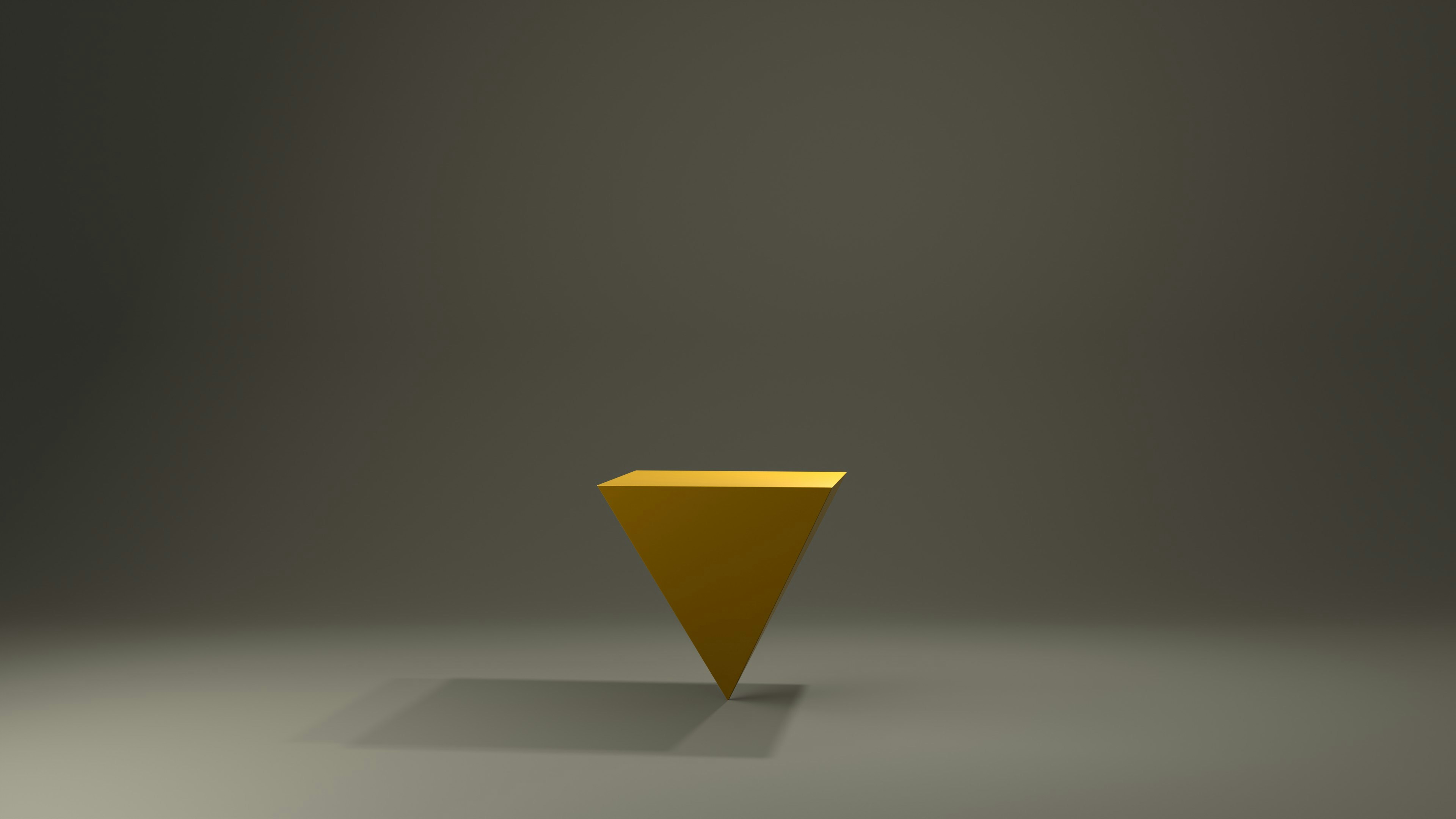 A yellow object sitting on top of a gray floor