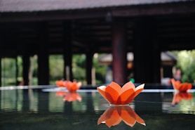 A group of paper flowers sitting on top of a table