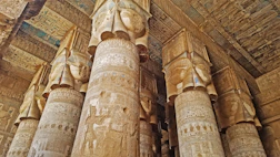 The columns of the temple are decorated with egyptian art